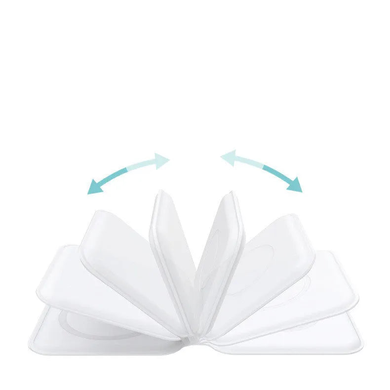 White magnetic wireless charging dock folded into a stand, charging a smartphone.