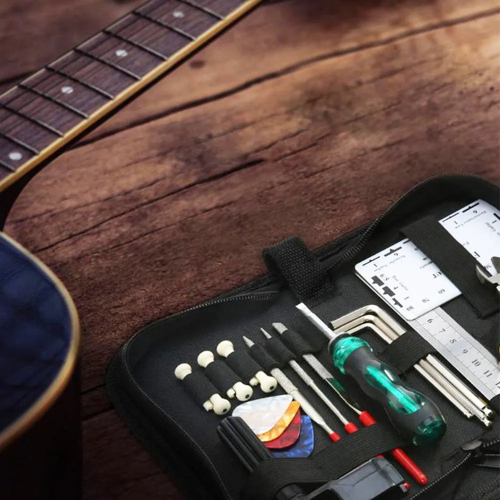 Black plastic case open to reveal 22 metal guitar repair tools including files, rulers, and wrenches for setup