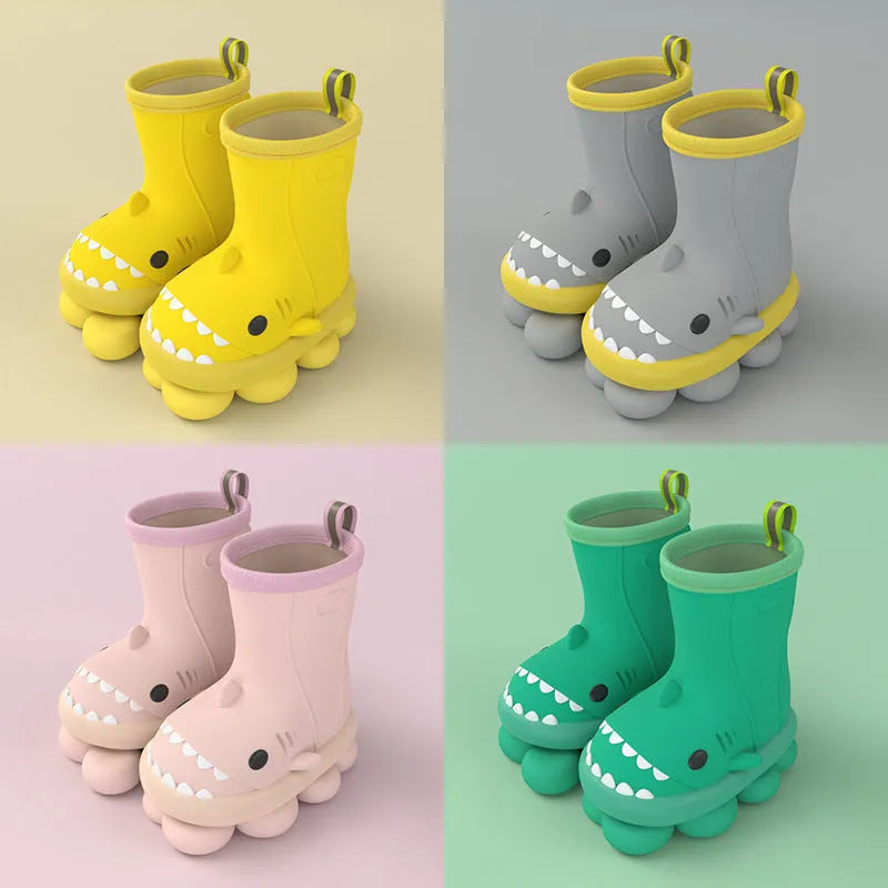 Shark brand children's green rain boots with a dinosaur graphic, showing medium height and plastic construction.