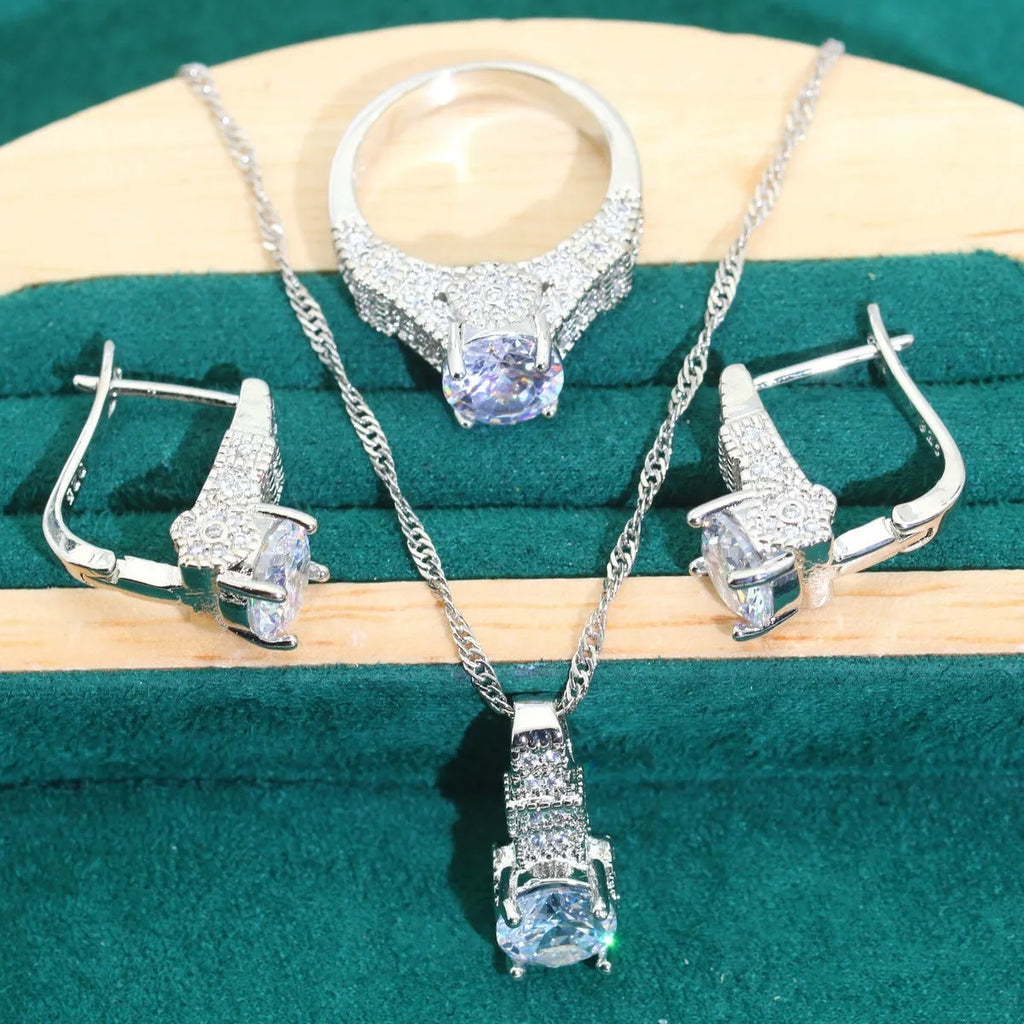 Four-piece bridal jewellery set showing necklace, bracelet, earrings and ring with alloy pendant and water wave chain