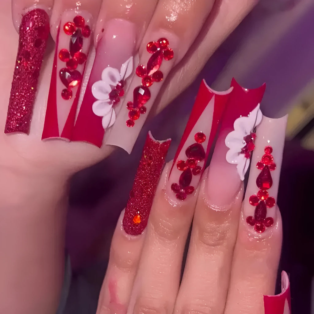 Artificial nails with floral pattern and red diamond accents in European square shape