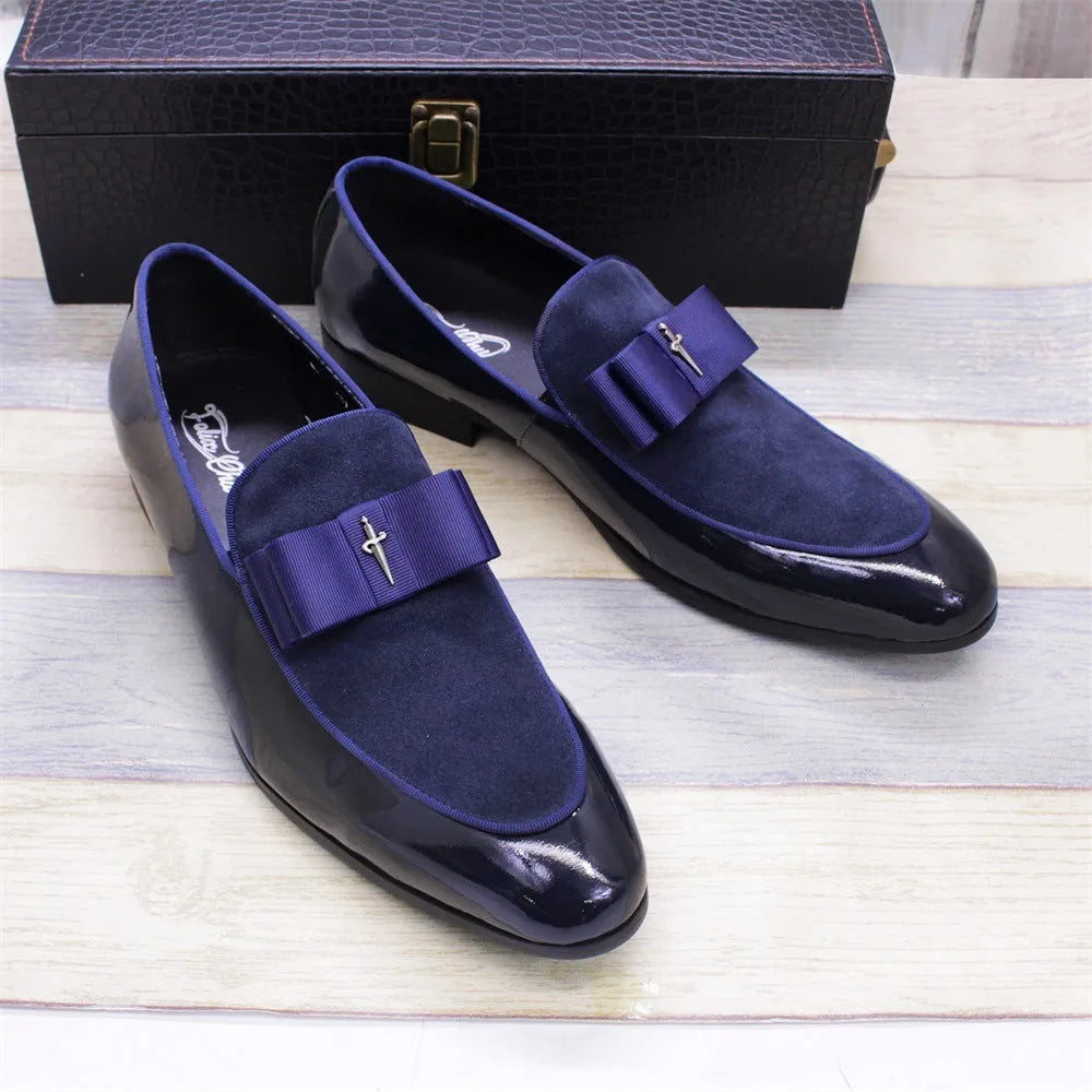 Men's glossy black patent leather low-top shoes with a tassel on a leather toe holder.