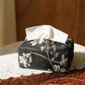 White Chinese brocade tissue box cover with embroidered plum blossoms, showing pearl buckle and plain opening options.