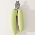 Banana-shaped pet nail clippers in green with metal blades for dog and cat grooming