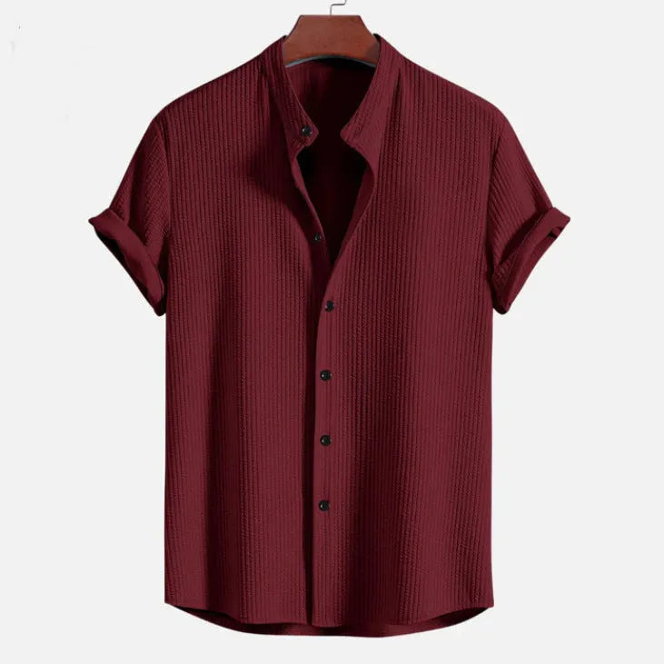 Men's loose-fitting short sleeve casual shirt in polyester, shown in a selection of available colours.
