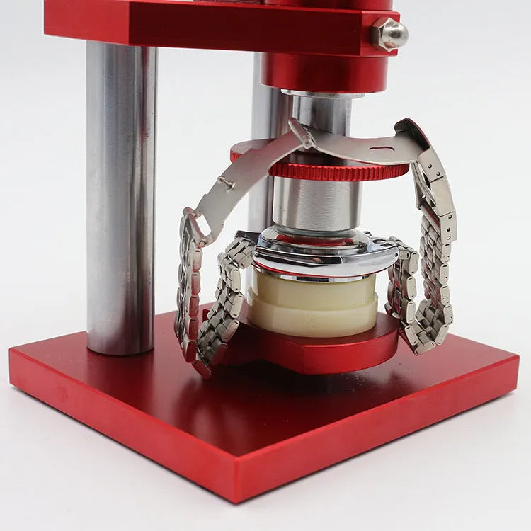 A watch back cover press tool with a spiral mechanism and a set of 20 plastic moulds for watch repair.