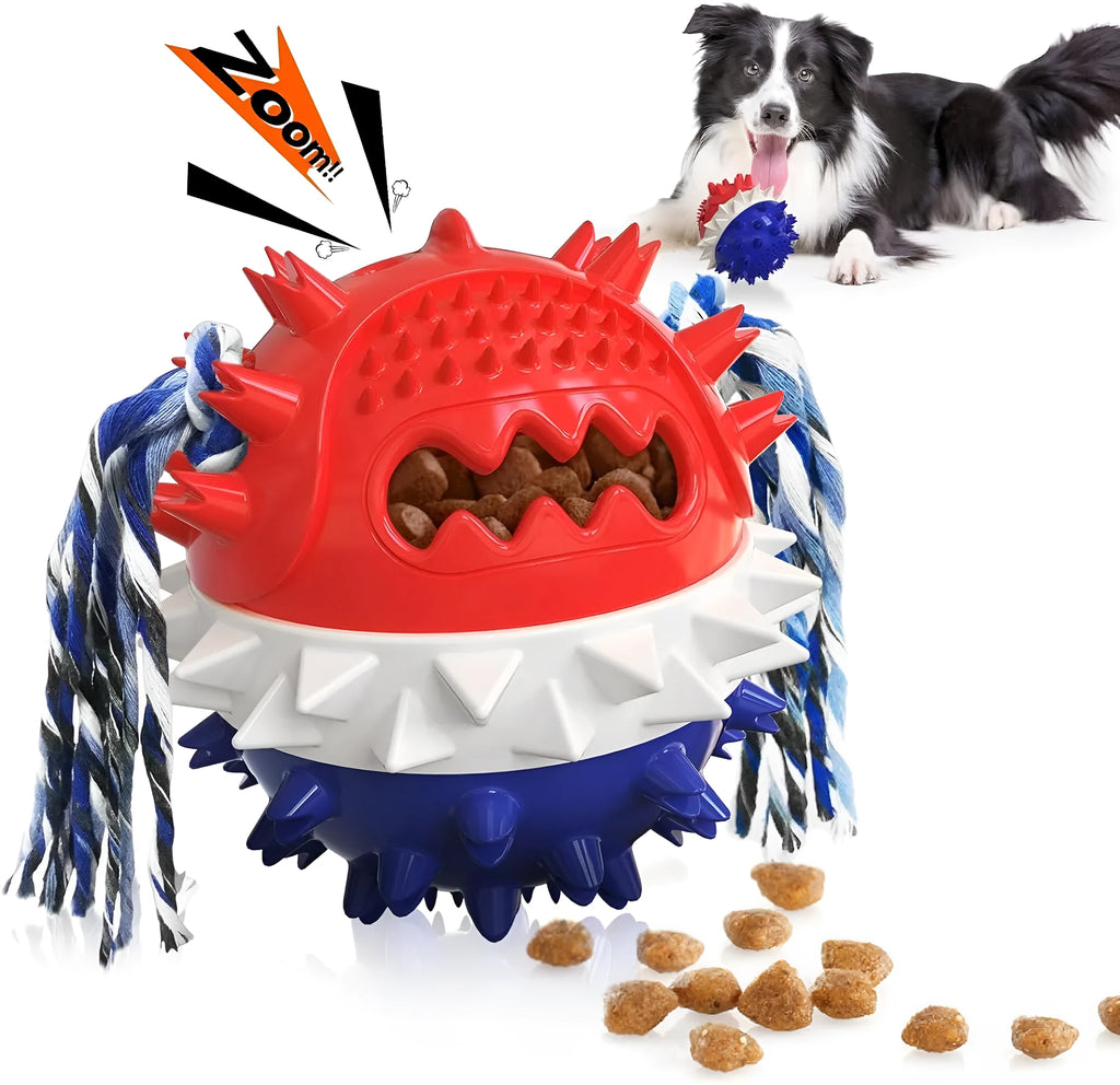 Blue and red ball-shaped dog chew toy with rope and treat dispenser hole on green grass