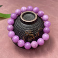 Purple Chinese-style quartz jade bracelet with multi-circle beads on a white background.