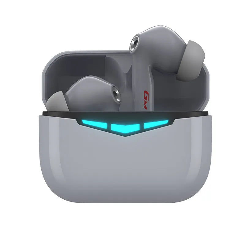 True wireless gaming earbuds in charging case, with spare silicone earmuffs, on a grey background.