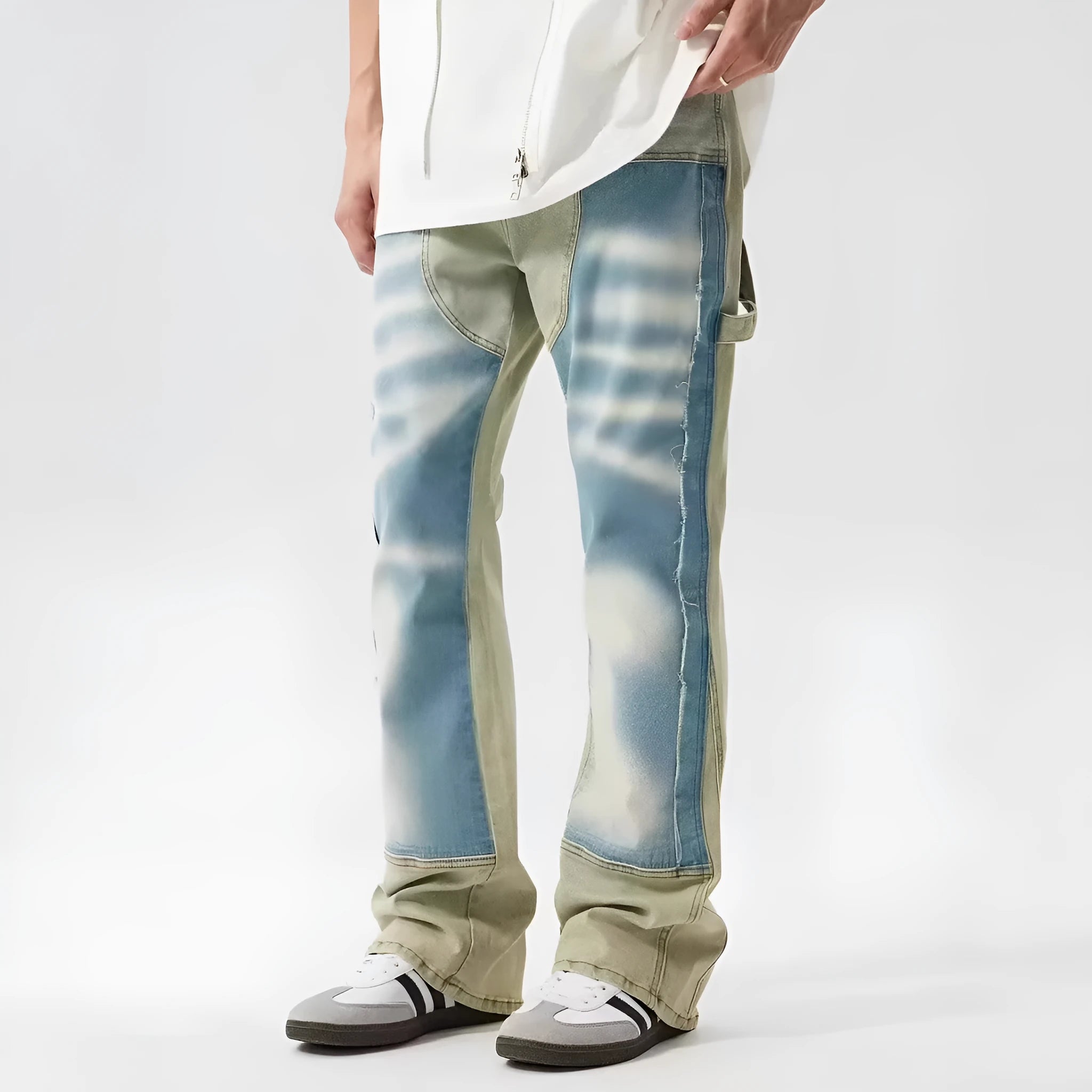 Yellow and blue patchwork distressed denim jeans with a mid-rise waist and zip fly.