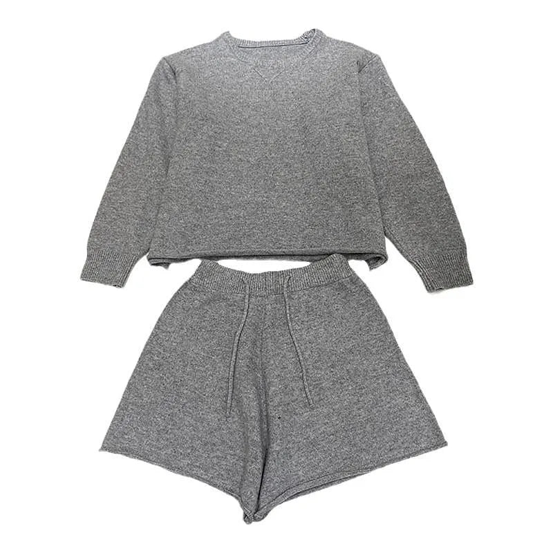 Women's loose-fit long sleeve acrylic knit sweater and matching wide-leg shorts set shown in oatmeal colour.