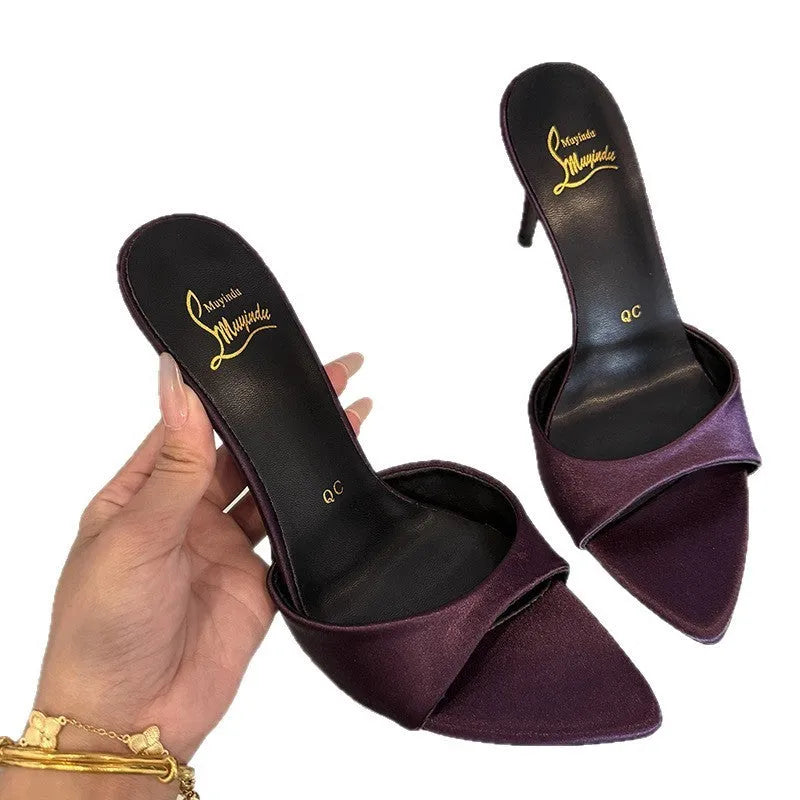 Women's black patent leather stiletto sandals with pointed toe and a high heel