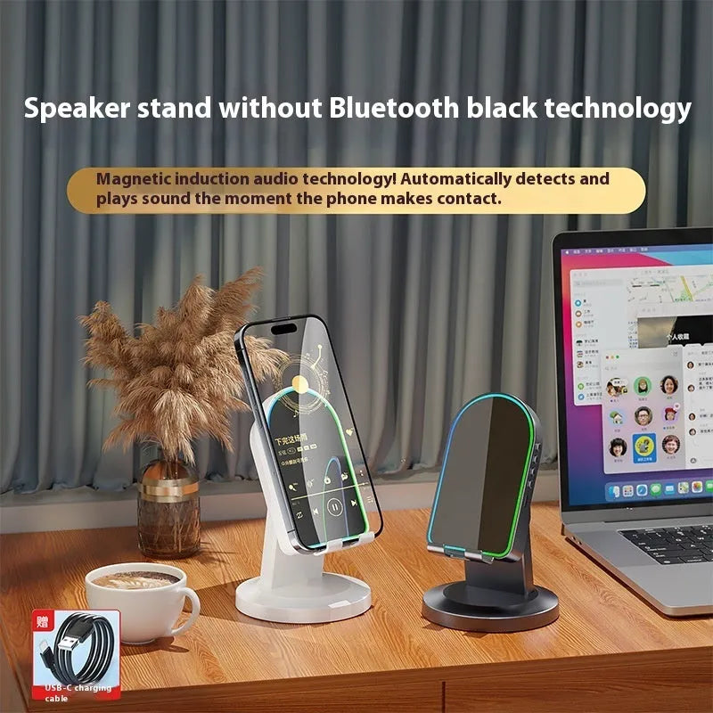 Three-in-one wireless induction Bluetooth speaker bracket with phone holder, black colour, mirror finish, showing USB port and built-in battery