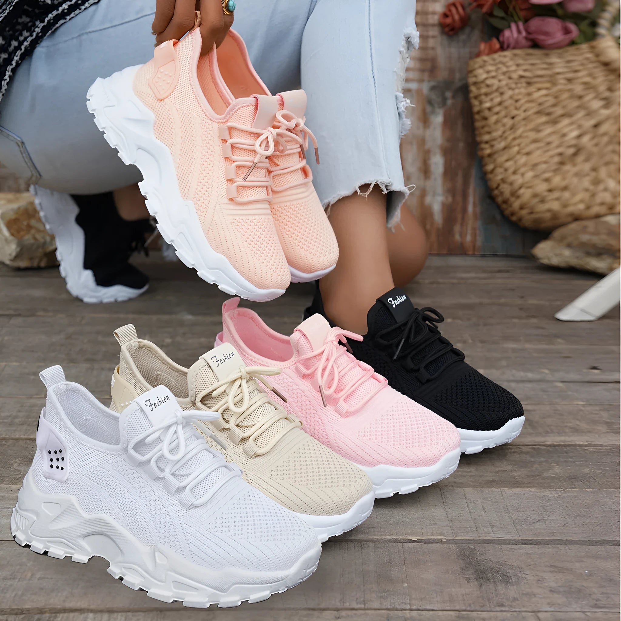 Women's white Flyknit mesh casual sports shoes with flat heel and lace-up front on a plain background.