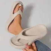 Women's black thick-soled EVA flip-flops with a non-slip sole design.