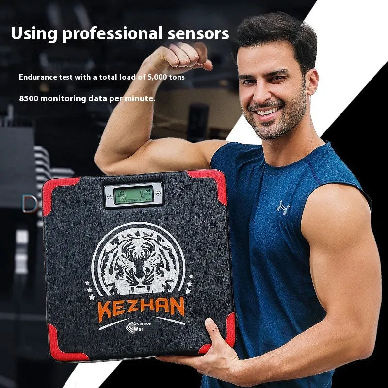 Smart hanging boxing training sandbag with integrated dynamometer unit for punch tracking.