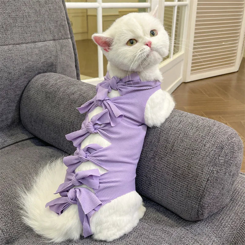 Lace-up cat recovery suit in blue, shown on a cat, featuring a full-body wrap design and adjustable back lacing.