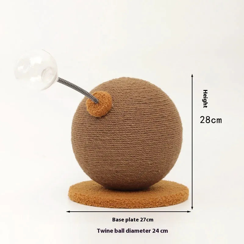 Natural hemp rope cat scratch board with attached toy ball on a wooden floor.