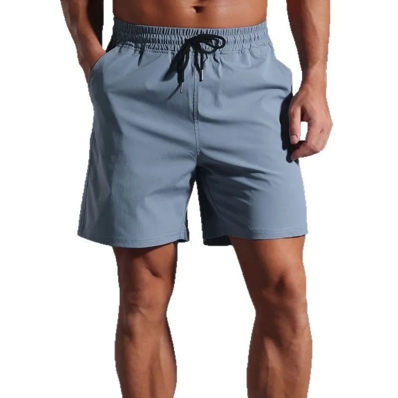 Men's loose casual shorts in quick-drying polyester fabric available in four colours