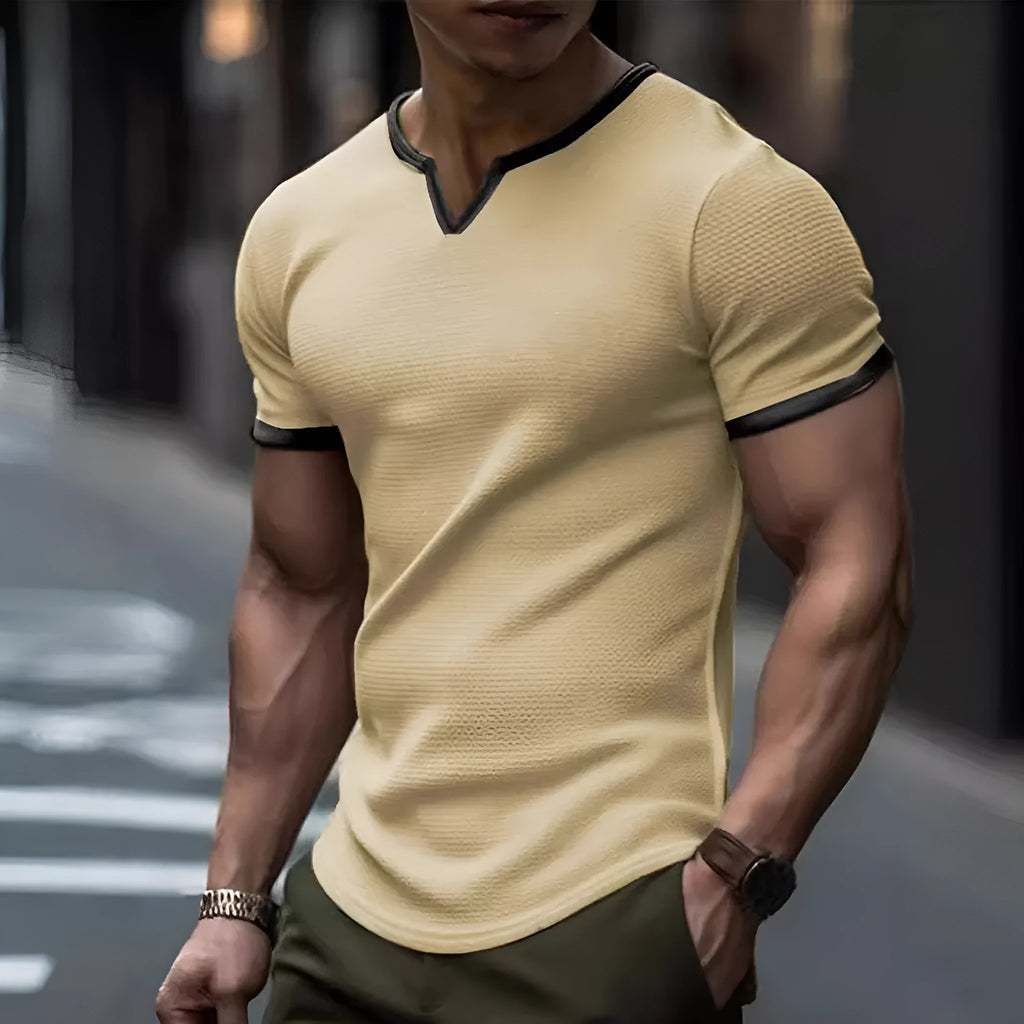 Colour-block V-neck short sleeve t-shirt in polyester waffle fabric on a neutral background.