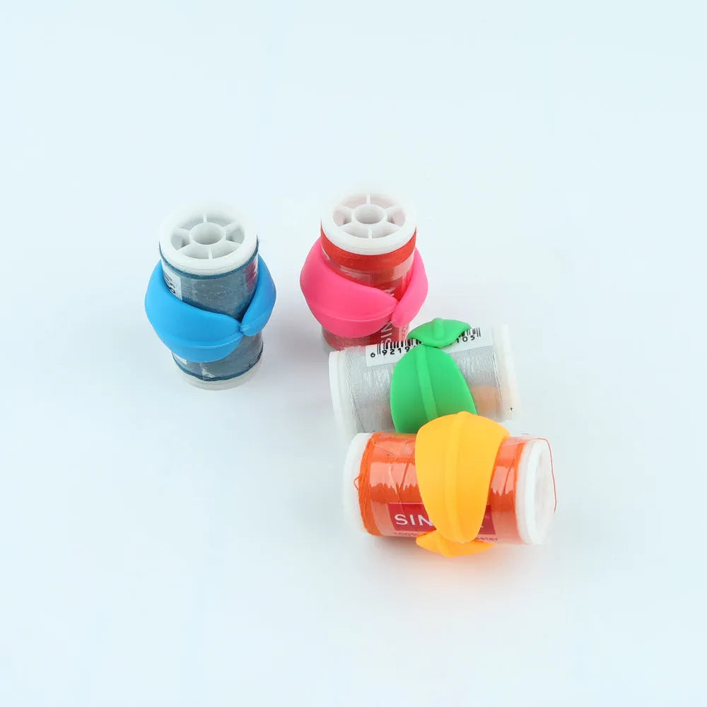 Set of 14 silicone sewing spool fixing clips in 20mm size in circle blue, green, orange, and pink