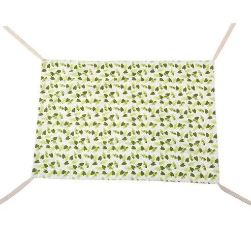 Portable crushed velour baby hammock attached to a white crib, shown in a pink colour.