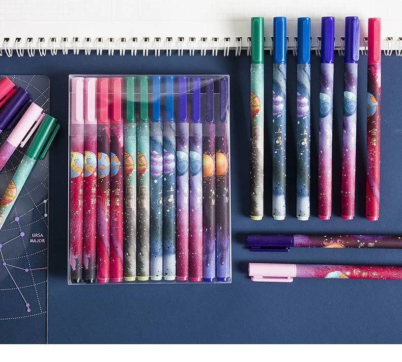 Twelve constellation zodiac ballpoint pens with bright star designs on plastic bodies, assorted colours, set of 12