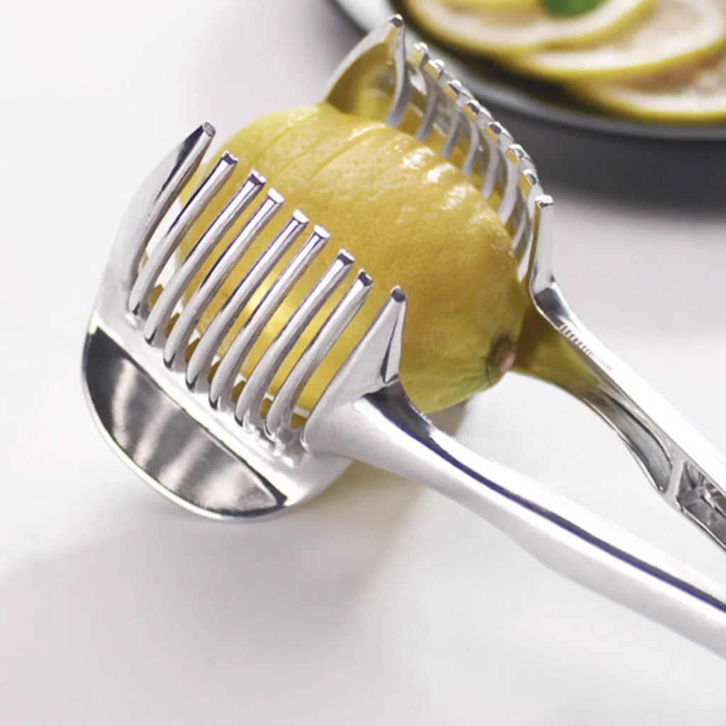 Silver plastic lemon slicer kitchen gadget for cutting fruits and vegetables