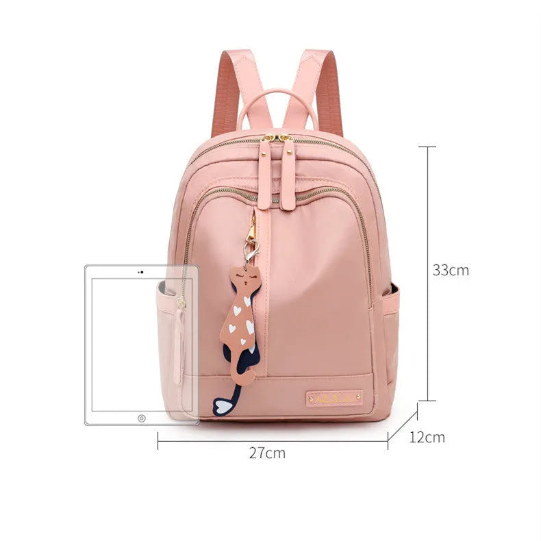 Black square nylon casual backpack with double shoulder straps and a front pocket.