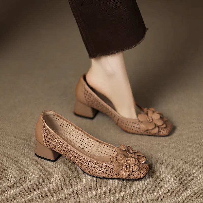 Women's light brown cowhide leather open weave pumps with a mid heel on a neutral background.