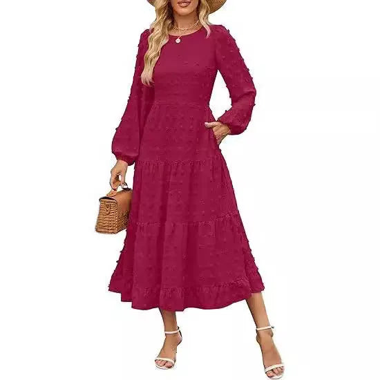 A beige high-waisted long sleeve dress with ruffled sleeves on a hanger.