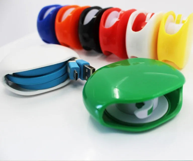 Automatic earphone cable winder unit in blue showing retracted cable, next to a black unit for size comparison.
