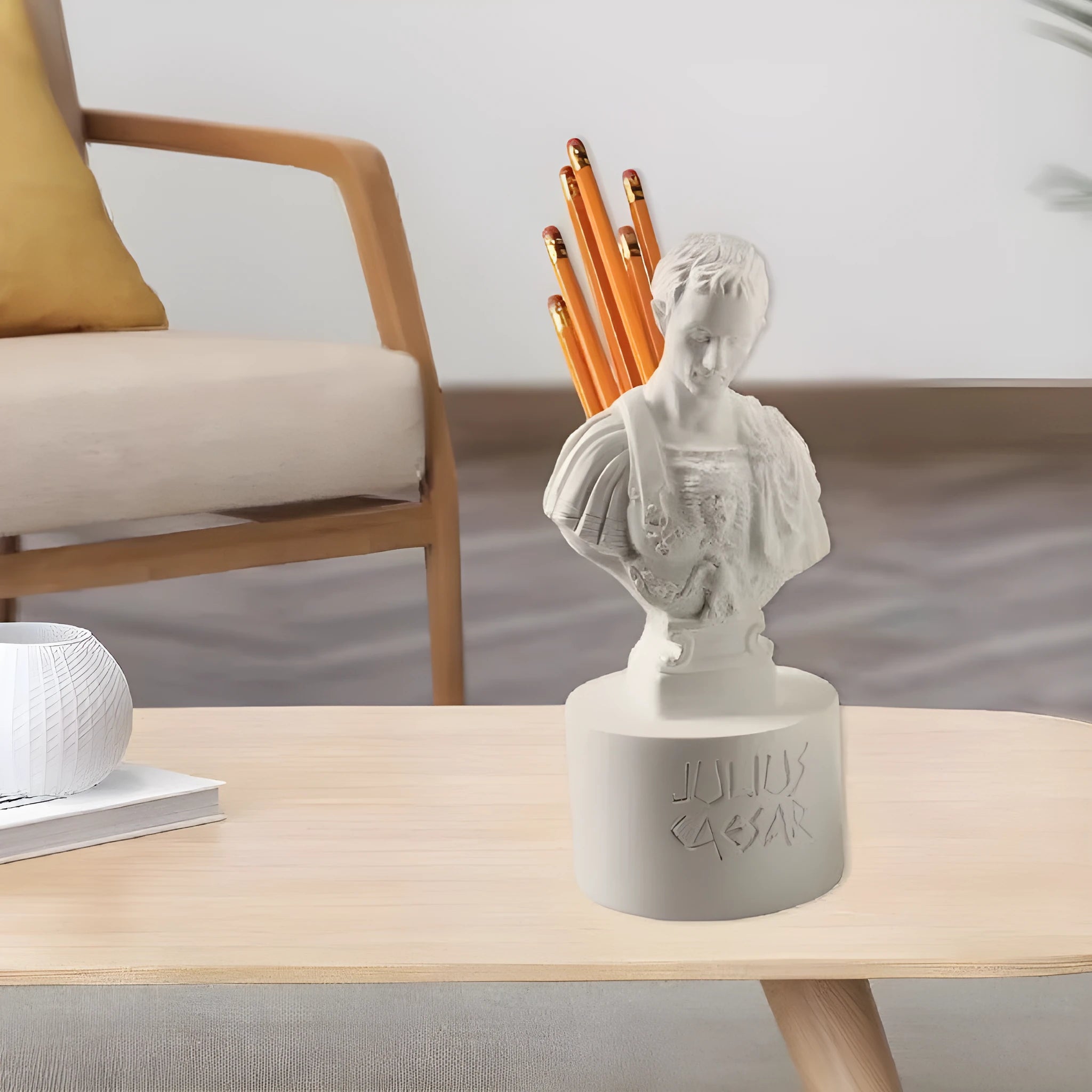White synthetic resin pen holder with American character sculpture design for holding pens on a desk.