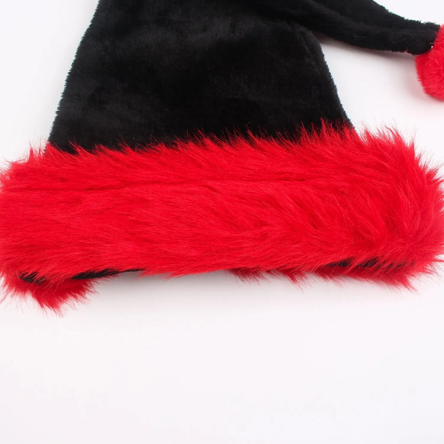 Plush Christmas hat in black and white or red and black colours with 56cm sizing for adult festive headwear