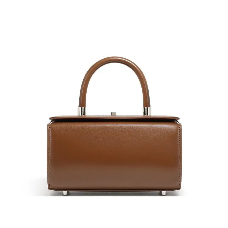 Women's cowhide leather crossbody bag in clamshell design with single shoulder strap