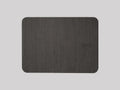 Wooden wireless charger with PU leather surface in brown finish on a desk