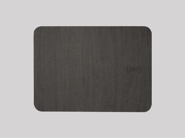 Wooden wireless charger with PU leather surface in brown finish on a desk