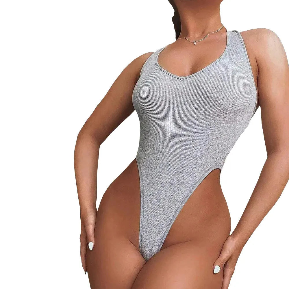 Grey viscose women's jumpsuit with halter vest top, suspenders, and high-waisted shorts.