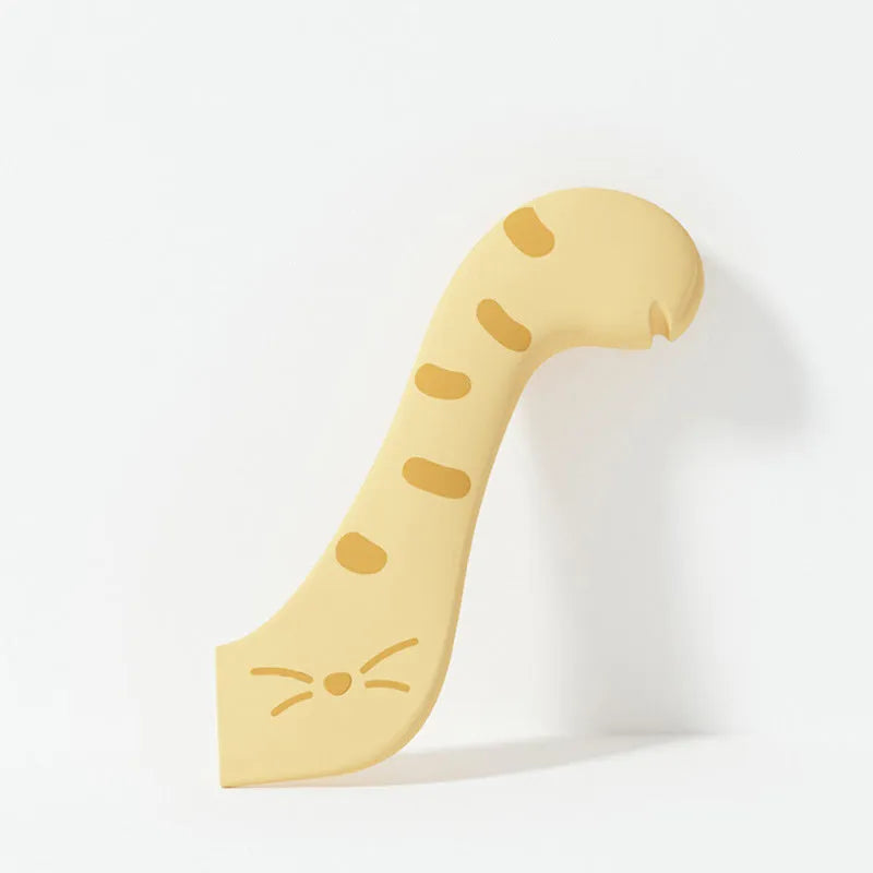 Grey silicone pet food spoon with integrated can opener and matching sealing lid for tins.