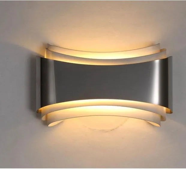 Modern LED wall lamp with warm white light, 23cm wide by 13cm high with matte finish