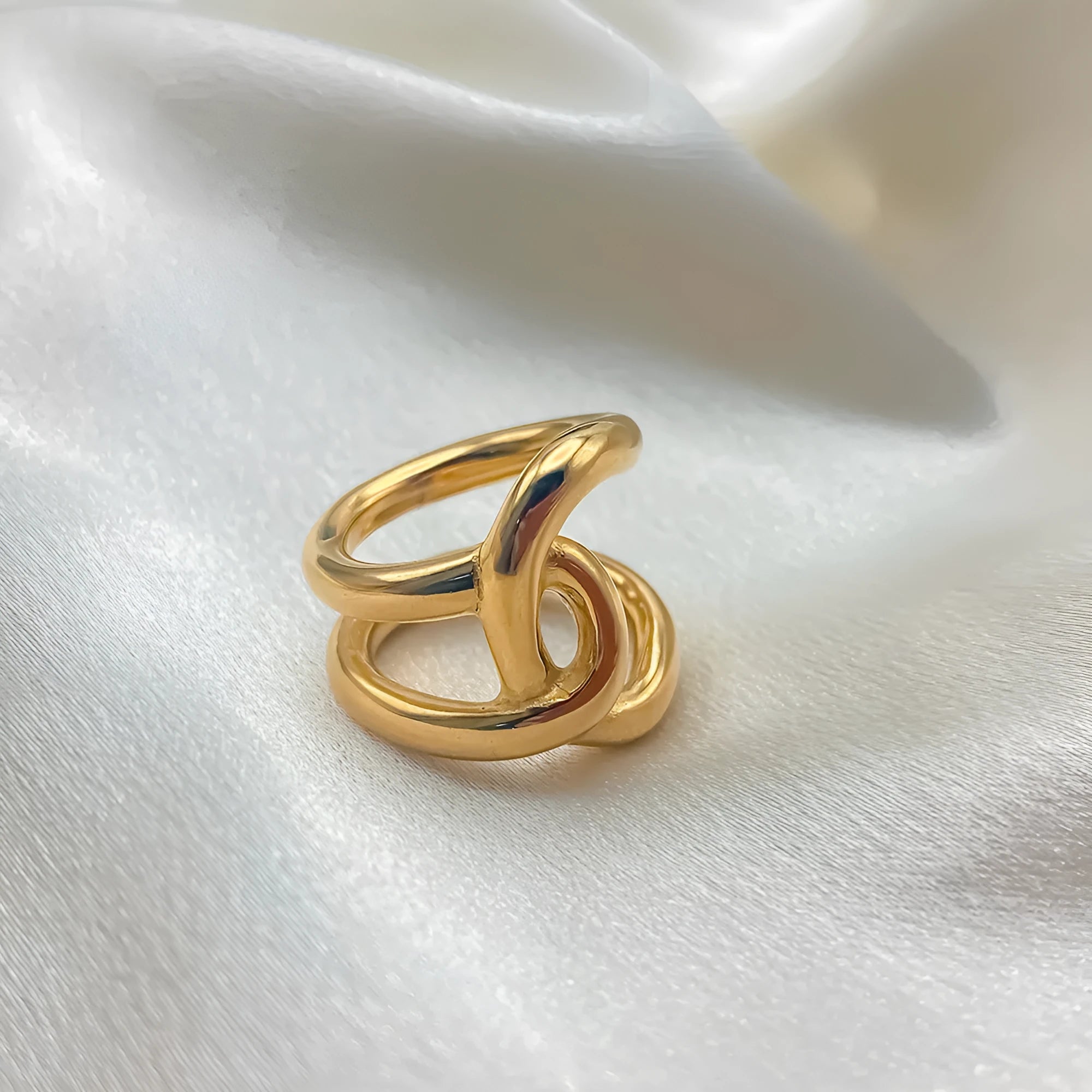 Women's adjustable stainless steel ring with geometric knot design on U-shaped opening
