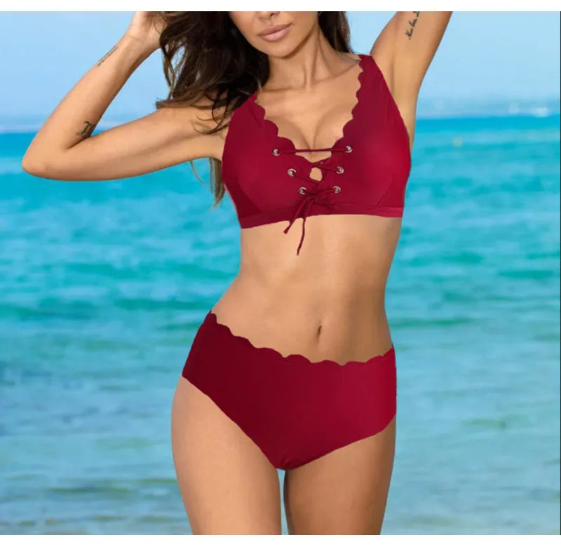 Women's red high waist split swimsuit with gathering detail on a mannequin.