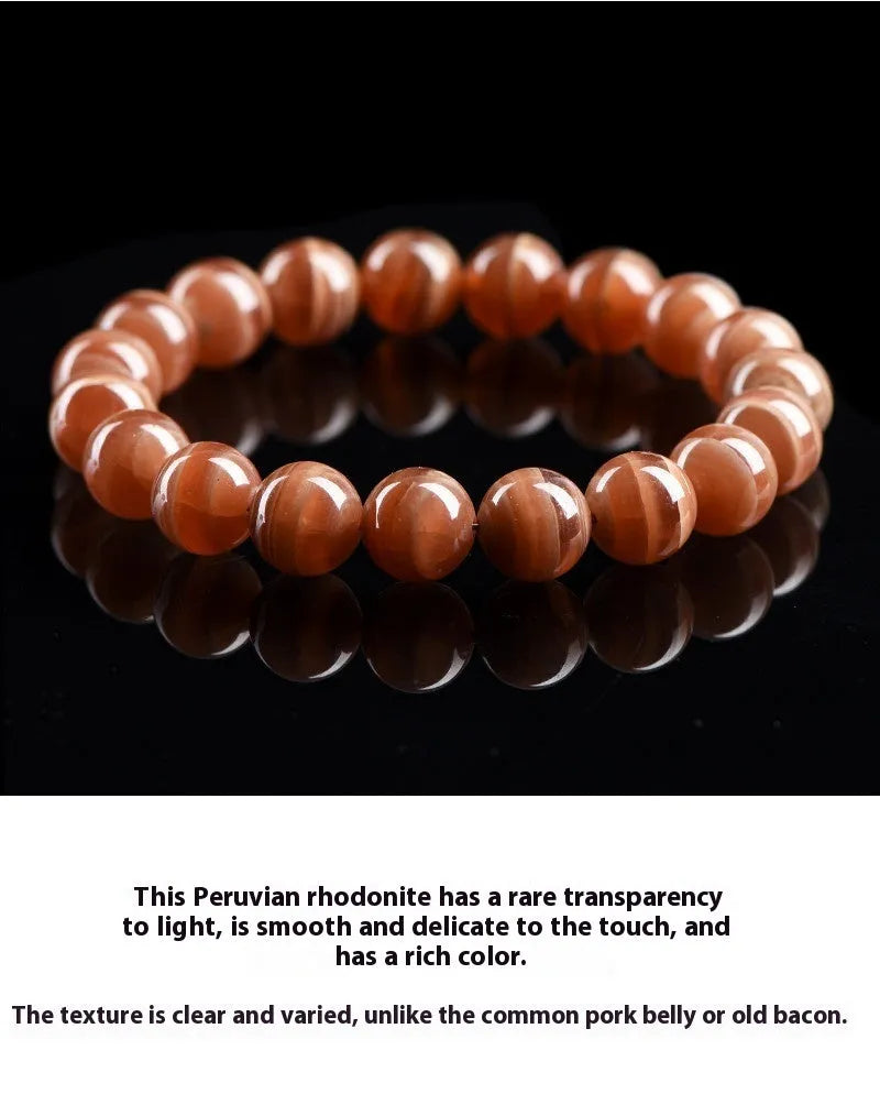 Natural old mine rhodochrosite round bead bracelet from Peru with ruyi charms.
