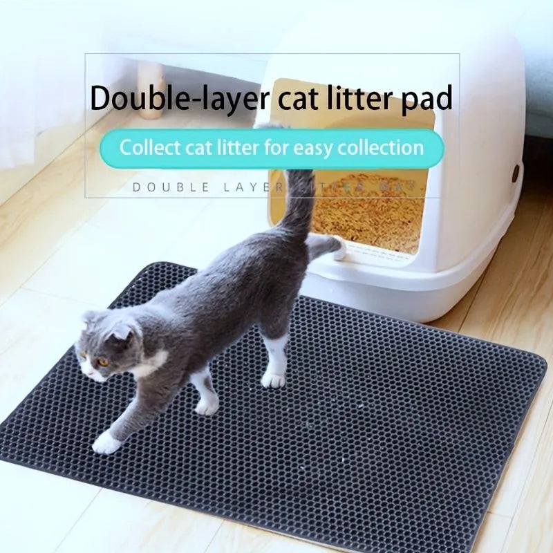 Black waterproof EVA cat litter mat with honeycomb surface for trapping litter, shown next to a litter box.