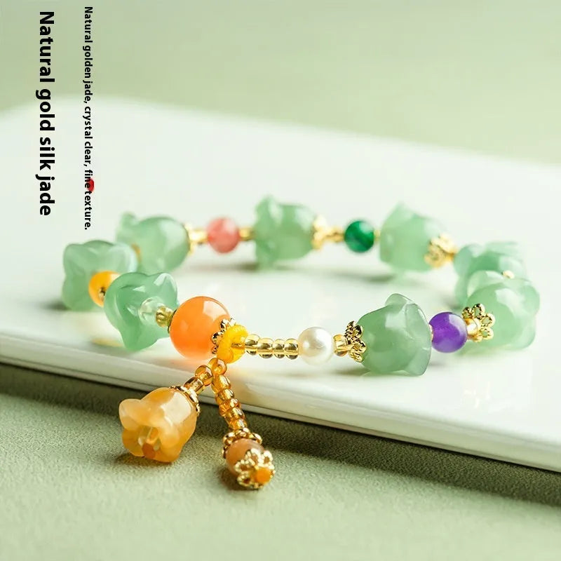 Carved natural Xinjiang Jinsi jade bracelet with aventurine orchid beads and Gobi jade topaz accents.