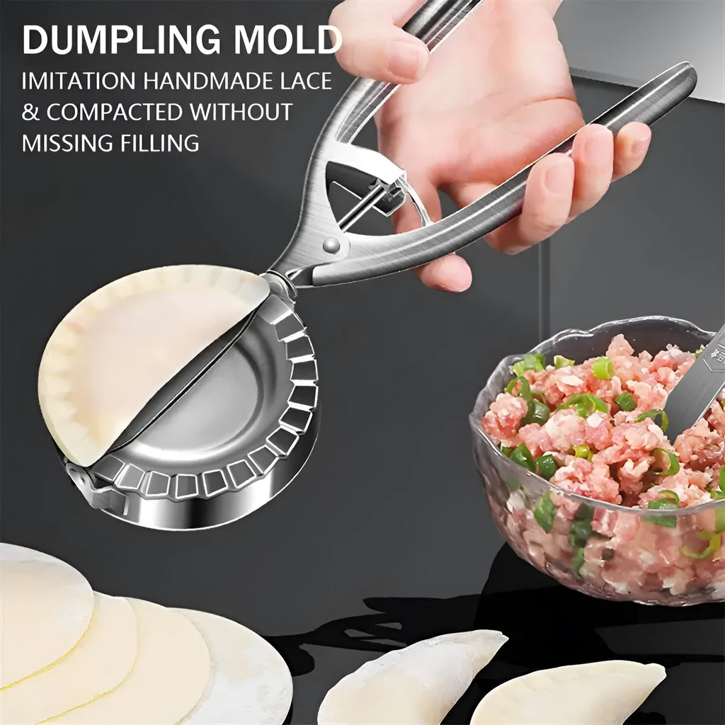 Silver stainless steel manual dumpling maker press tool on a kitchen surface.