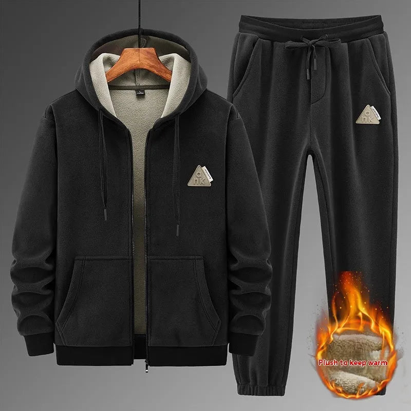 Grey cashmere-blend hooded sports jacket and matching full-length trousers laid flat.