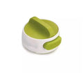 A green stainless steel manual bottle opener and lid removal tool on a kitchen counter.