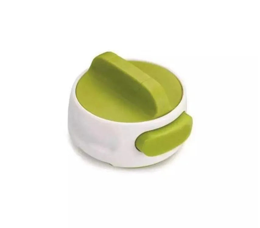 A green stainless steel manual bottle opener and lid removal tool on a kitchen counter.