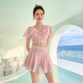 Women's solid colour two-piece swimsuit with a separate top and skirt.
